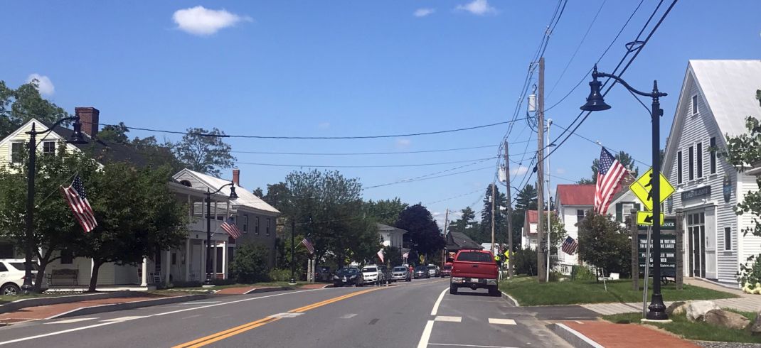 Main Street (Route 27) in Belgrade Lakes Village, looking north. The Maine Lakes Resource Center is on the right.