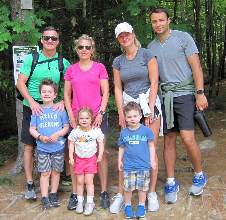 Three generations of the Corcoran Family pause for a photo while hiking at Mount Phillip.