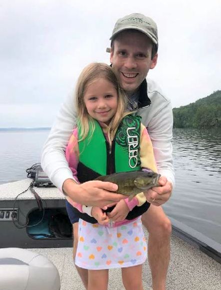 Tim, Doina, and a smallmouth bass