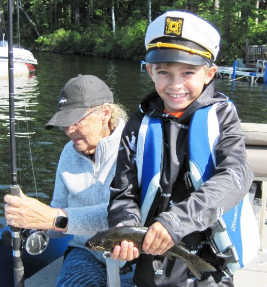 Miles holds a smallmouth bass.