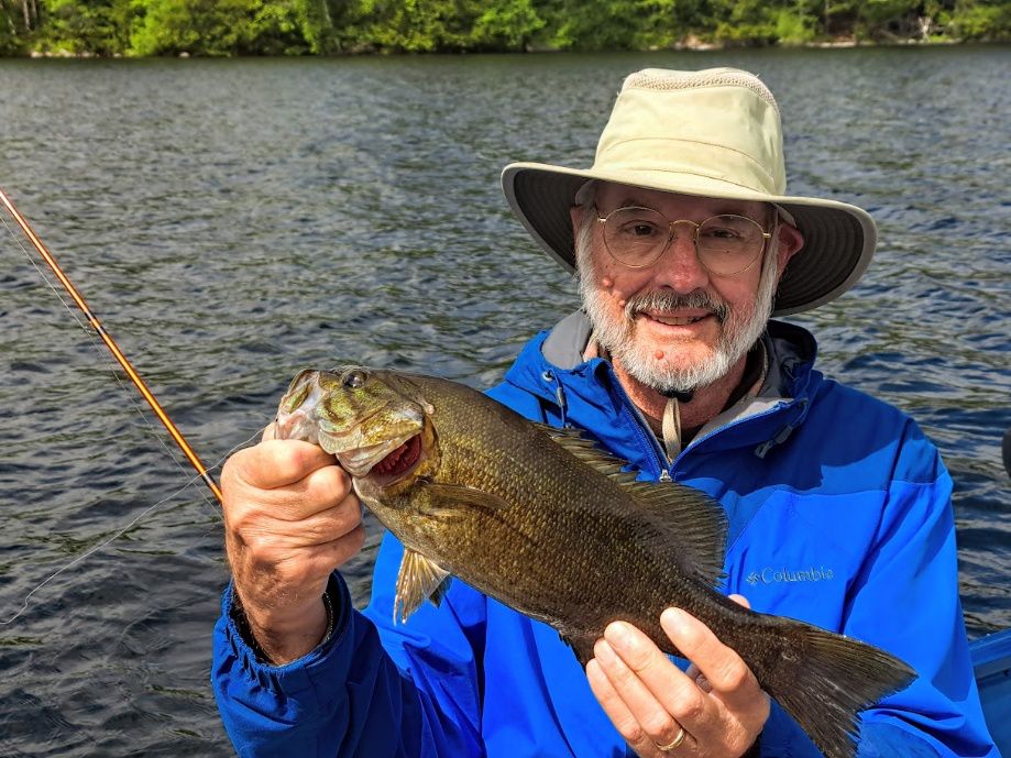 Larry Hawley with nice smallmouth caught on a White Zonker.