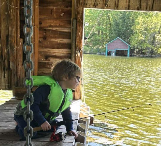 Connor Kowalsky stalking sunfish in the boathouse.