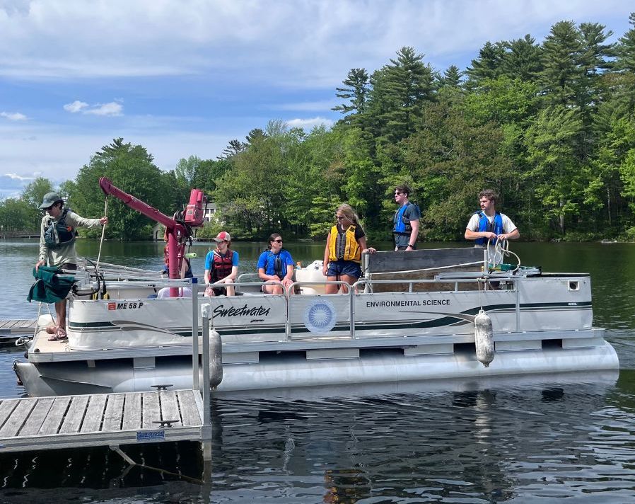 Colby students aboard <i>The Compass</i>, practicing boater safety and diving into water quality monitoring requirements.