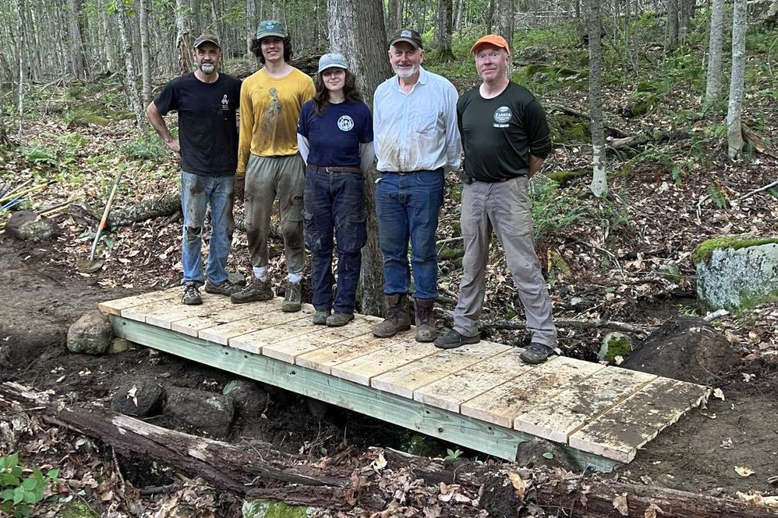 Tom Arminio, Cam Rogers, McKenna Thompson, Malcom Campbell and Scott Guay on a new bridge over an intermittent stream on the Blaisdell Trail.